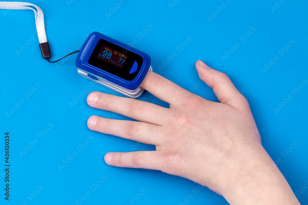 Pulse oximetry on the finger with blue background. Pulse oximetry a noninvasive and painless test that measures oxygen saturation level. Part of set. Pulse oximetry on the finger with blue background. Pulse oximetry a noninvasive and painless test that measures oxygen saturation level. Part of set.
