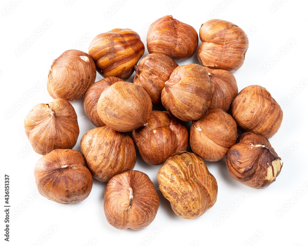 pile of shelled hazelnuts closeup on white pile of shelled hazelnuts closeup on white