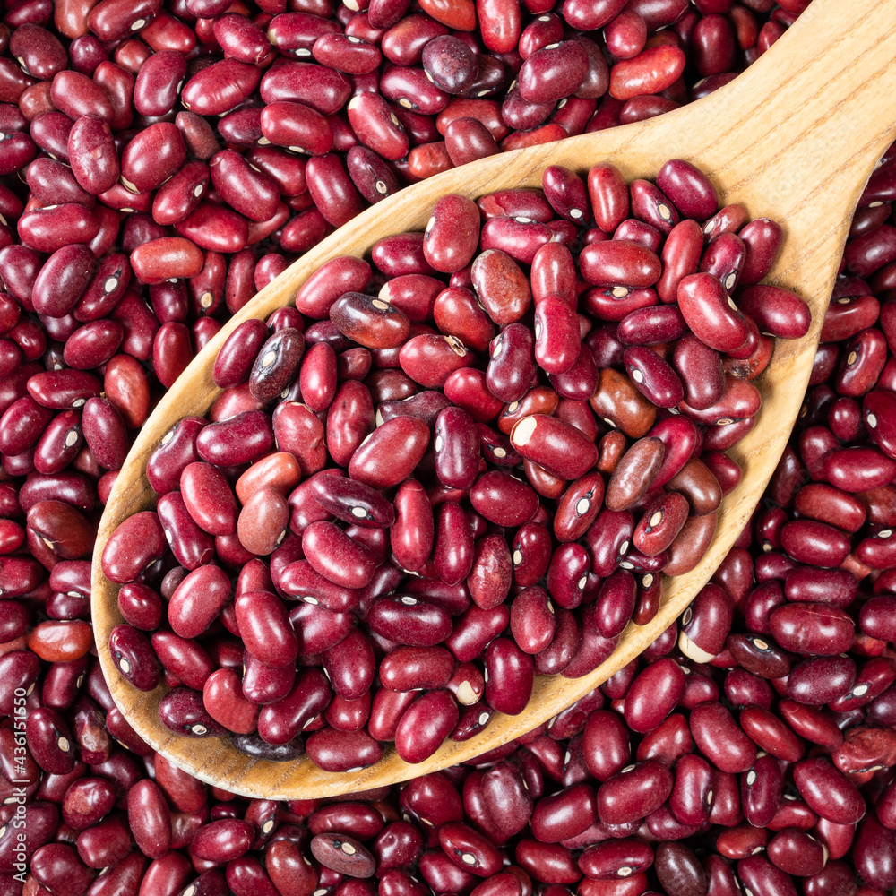 mexican red beans in wooden spoon closeup mexican red beans in wooden spoon closeup