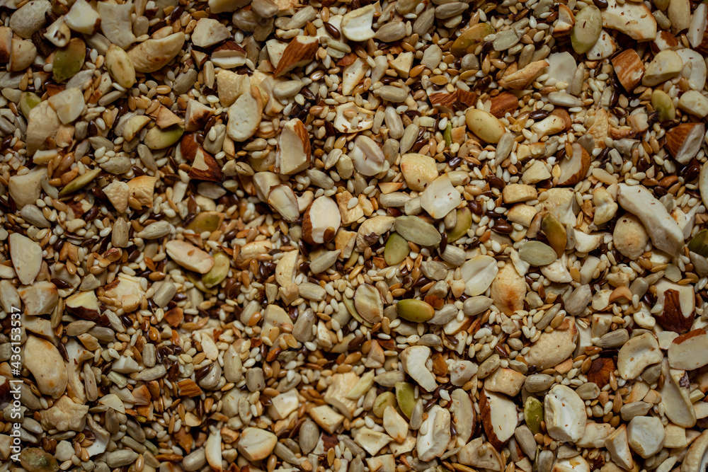 Nut and seed mix before cooking, close up view background. Macro image. Nut and seed mix before cooking, close up view background. Macro image.