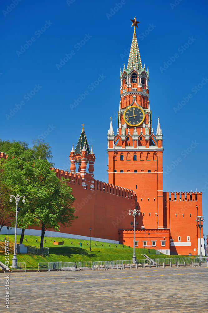 Spasskaya tower on Red Square in Moscow on the sunny day. View of the of Moscow Kremlin and Red Square. Travel to the capital of Russia. Spasskaya tower on Red Square in Moscow on the sunny day. View of the of Moscow Kremlin and Red Square. Travel to the capital of Russia.