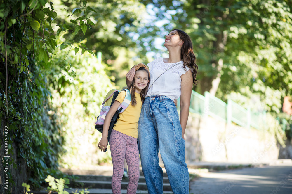 Little girl walking to school with her mother. Little girl walking to school with her mother.