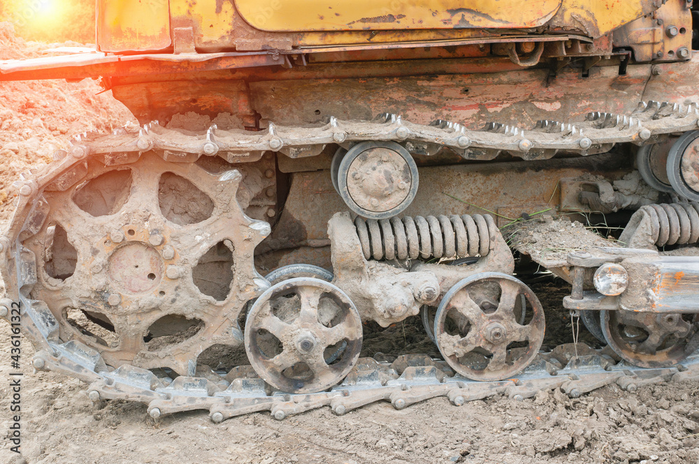 Close-up of the inner undercarriage of an old excavator. Old but still working technologies today