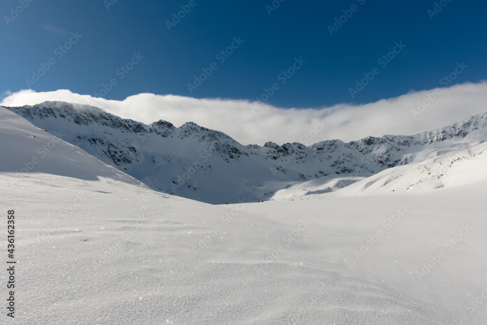 Mountain valley covered with snow. Tatra Mountains Poland Europe. Sunny day in the mountains.