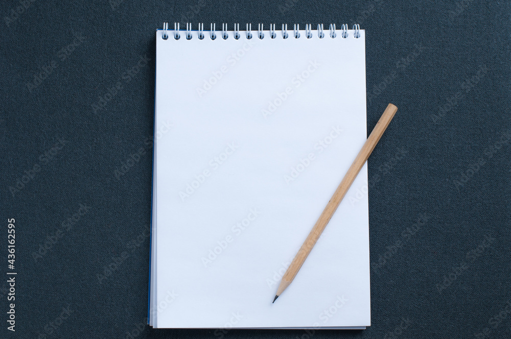 Blank notebook and pencil isolated on dark background mockup Blank notebook and pencil isolated on dark background mockup