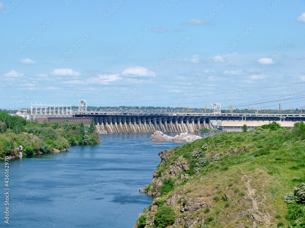 Panorama from the middle of the bridge of the main attraction of Zaporozhye - Dnieper hydroelectric power station.