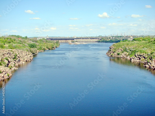 Landscape of the Dnieper current, which flows from the height of the Zaporozhye dam and bypasses the rocky rapids.