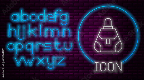 Glowing neon line Handbag icon isolated on brick wall background. Female handbag sign. Glamour casual baggage symbol. Neon light alphabet. Vector