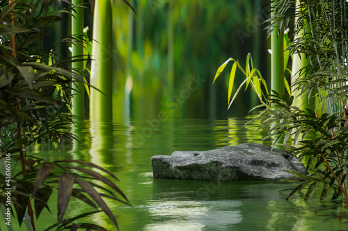 Fototapeta Naklejka Na Ścianę i Meble -  Natural rock podium with water surround with bamboo environment