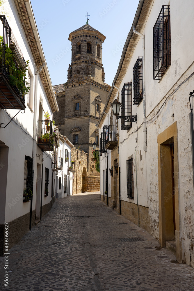 Typical streets in the old town of Baeza with the old University tower, World Heritage Site by UNESCO, JAen, Spain.