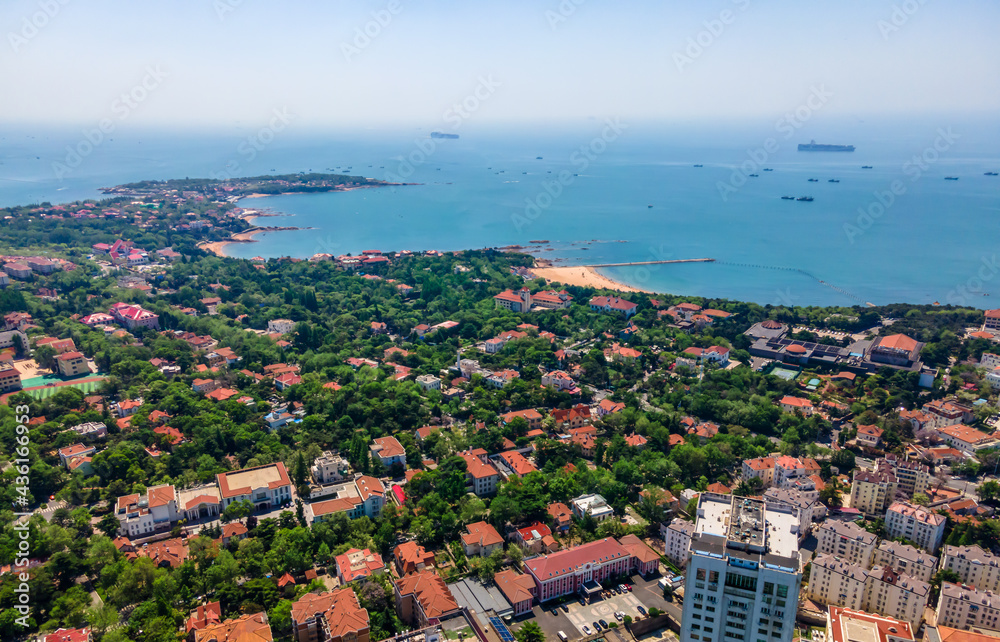 Obraz premium Aerial photography of architectural landscape skyline along Qingdao urban coastline