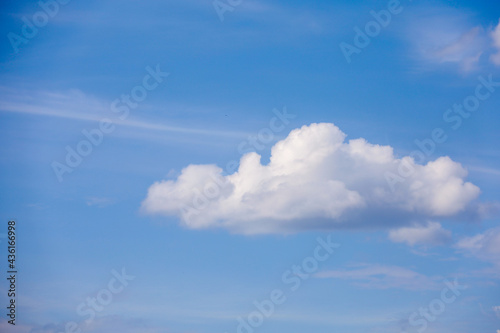 Cumulus soft cloud in the blue sky. Heavenly cloudy background