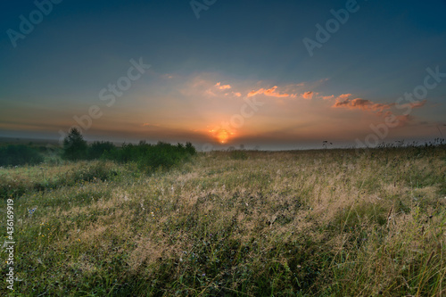 sunrise over the field in central russia