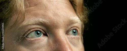 Isolated close-up of nice man blue eyes