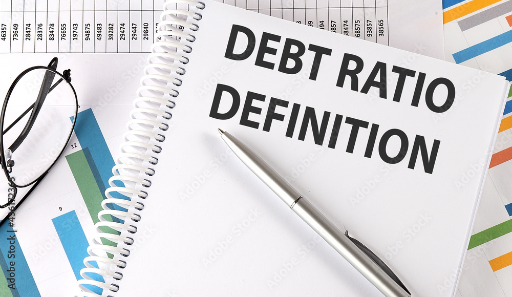 Debt Ratio Definition text on notebook on chart background Debt Ratio Definition text on notebook on chart background