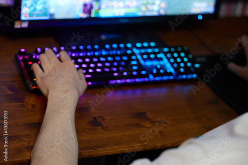 Photo of a hand using a keyboard. Back view. High resolution photos