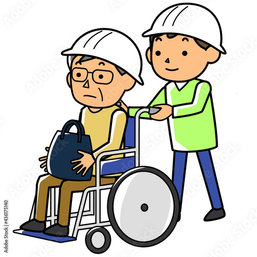 災害時に車いすで避難する高齢者と支援する男性