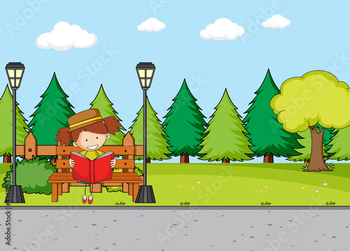 Park scene with a girl reading book sitting on bench