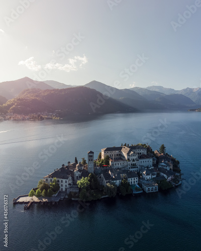 Slika na platnu Vertical aerial shot of San Giulio island on lake Orta at sunset.