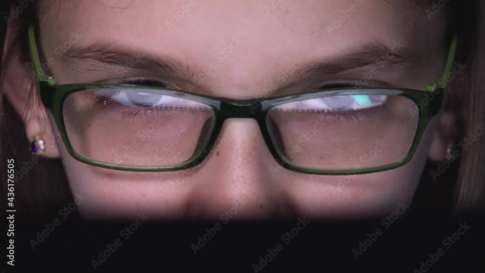 Girl Playing on Laptop, Computer in Night, Eyeglasses Kid Browsing Internet on Desktop, Child Plays Video Games, Online Education Girl Playing on Laptop, Computer in Night, Eyeglasses Kid Browsing Internet on Desktop, Child Plays Video Games, Online Education