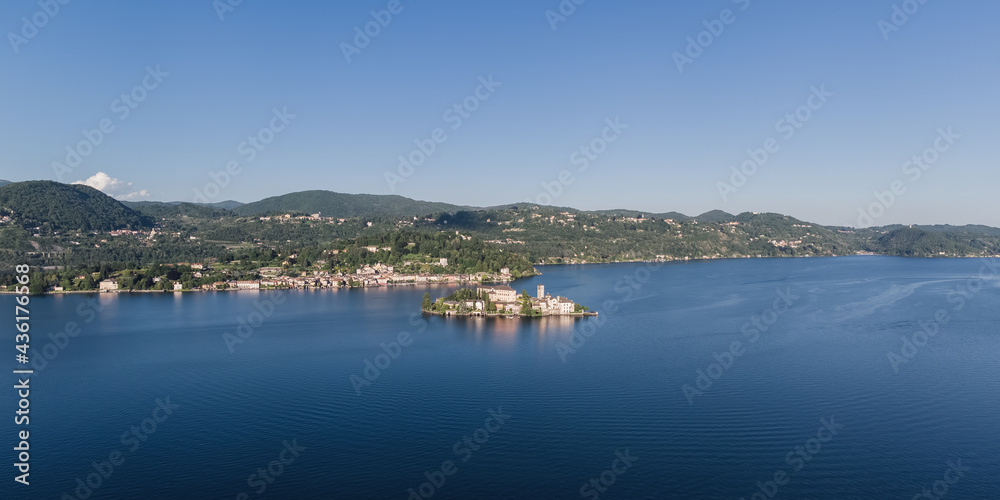 Panoramic landscape of Orta San Giulio and San Giulio island on Lake Orta.