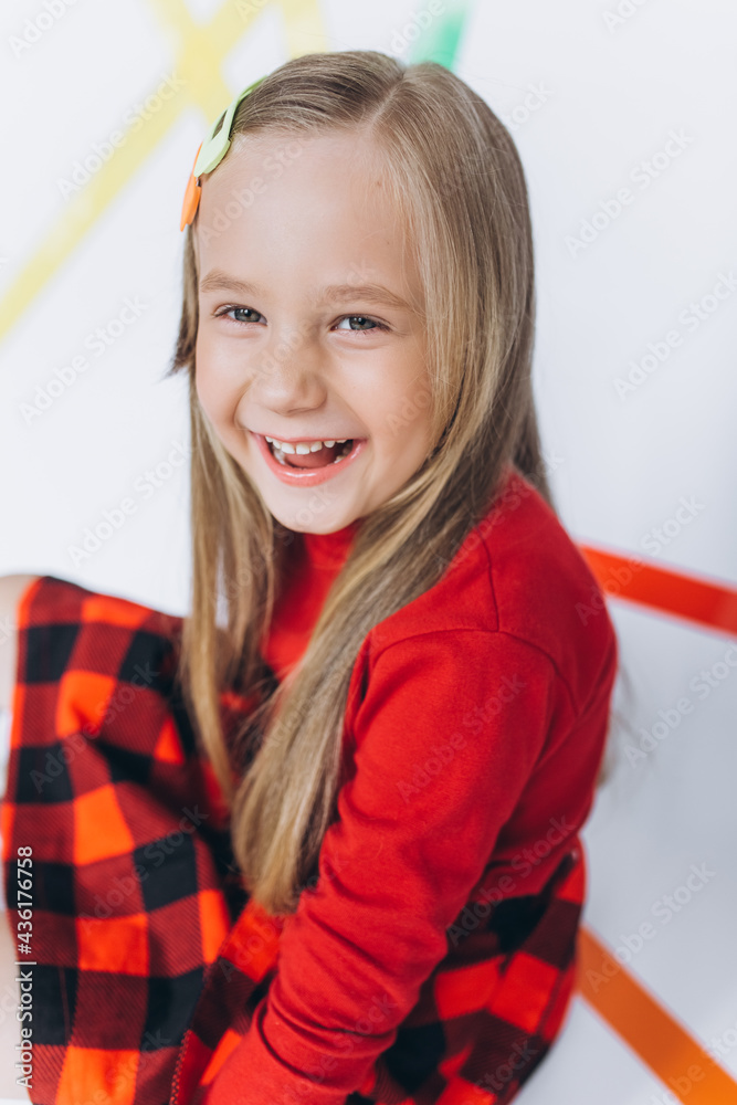 Happy cute blondie little funny girl smile and have fun. Children games, fashion kids concept Happy cute blondie little funny girl smile and have fun. Children games, fashion kids concept