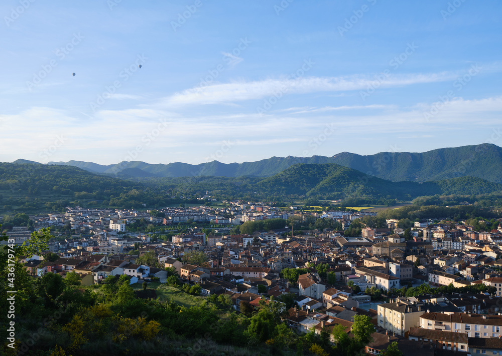 views of the city of olot, at dawn from the top of the Montsacopa volcano, in the province of girona, catalonia.