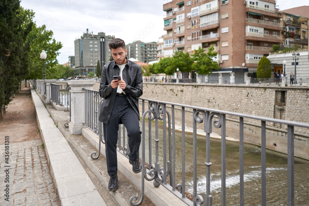 Caucasian men with beard, with smartphone in hand Caucasian men with beard, with smartphone in hand