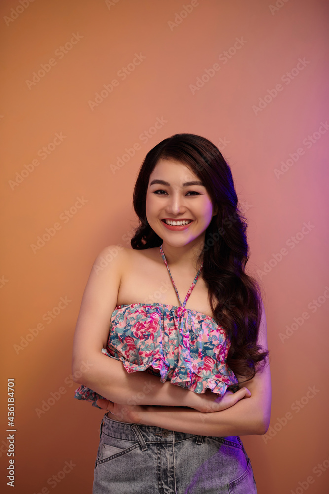 High Fashion model woman in colorful bright neon lights posing in studio, night club High Fashion model woman in colorful bright neon lights posing in studio, night club
