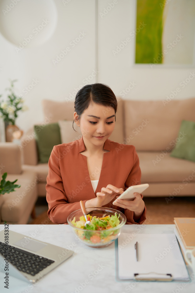 Working lunch at home attractive woman with laptop eat salad Working lunch at home attractive woman with laptop eat salad
