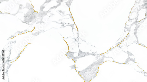 White marble polished stone texture with golden cracks pattern for design background. Close-up.