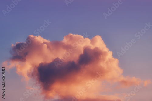 Small fluffy cloud background on soft sunset sky