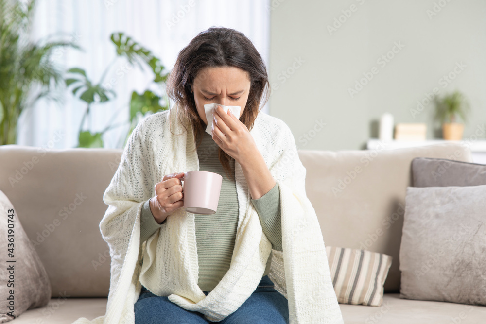 Young woman suffering from cold. Young woman suffering from cold.