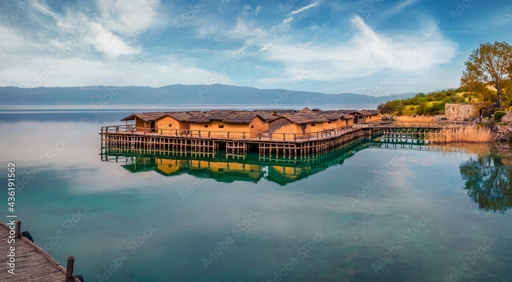 Calm morning scene of popular tourist destination - Bay of Bones. Picturesque spring view of Ohrid lake. Amazing landscape of North Macedonia, Europe. Traveling concept background..