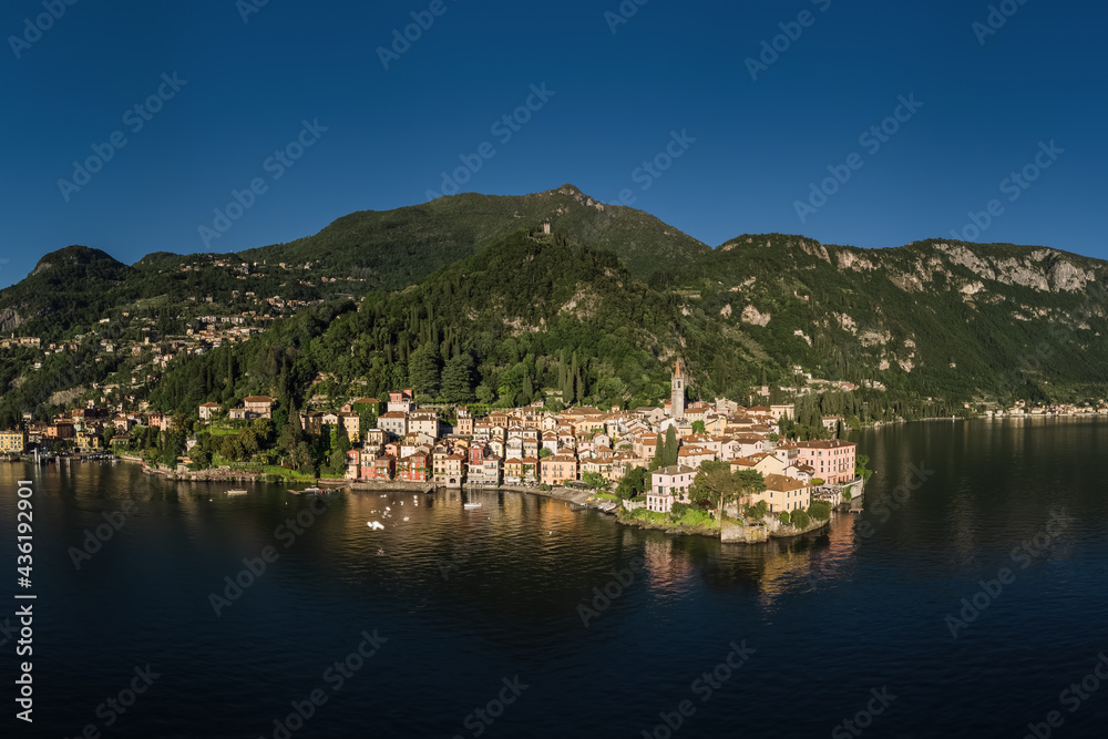 Aerial Panorama of Varenna city on Lake Como with the bell tower of the village.