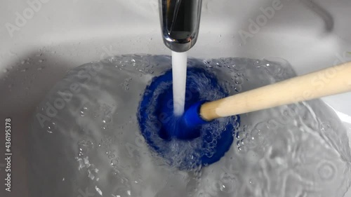 A plunger is used to unblock a sink drain