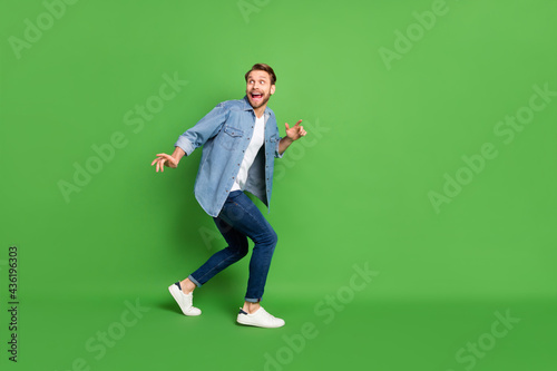 Canvas Print Full length body size photo of thief sneaking away looking back isolated vivid g