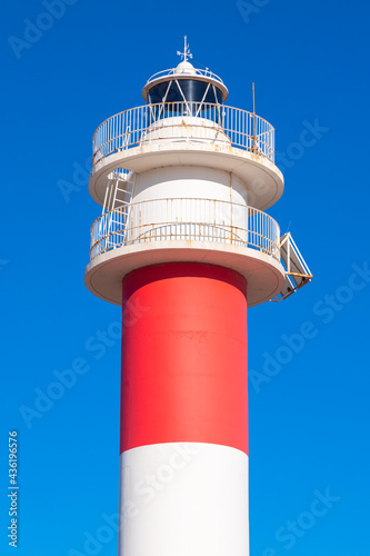 "Fangar" lighthouse situated in Ebro Delta beach. Picture taked in a sunny with a clear blue sky.