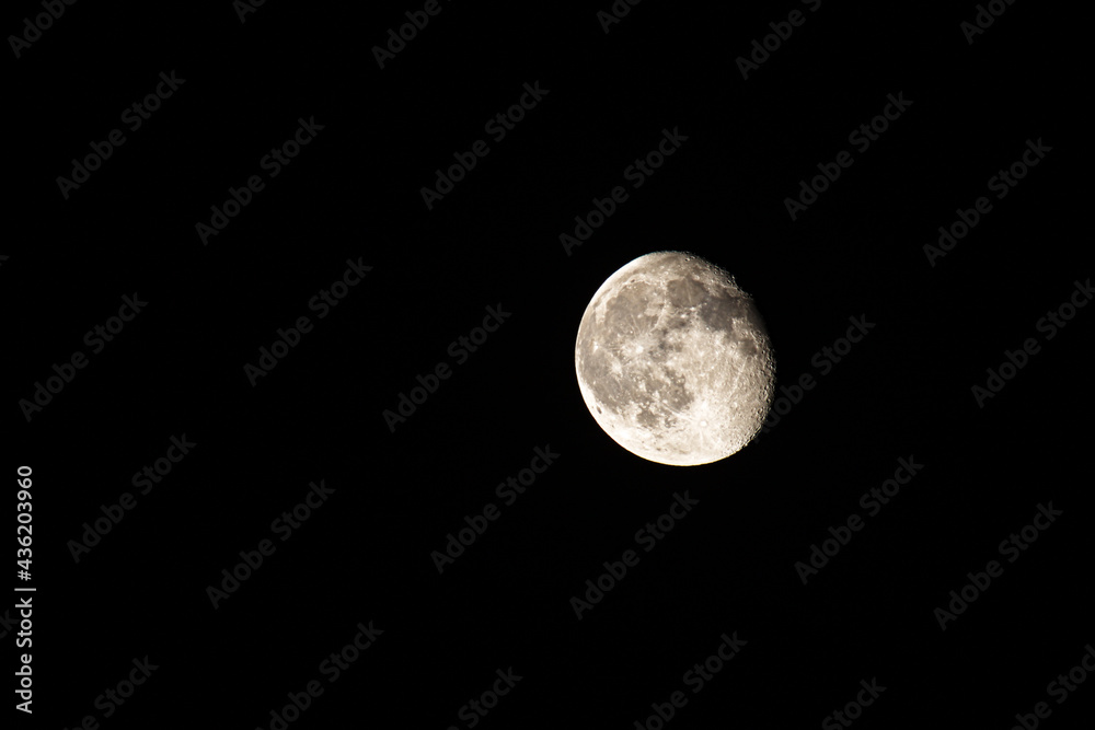 Waning gibbous moon on a black background Waning gibbous moon on a black background