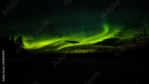 Northern lights and clouds in northern Sweden