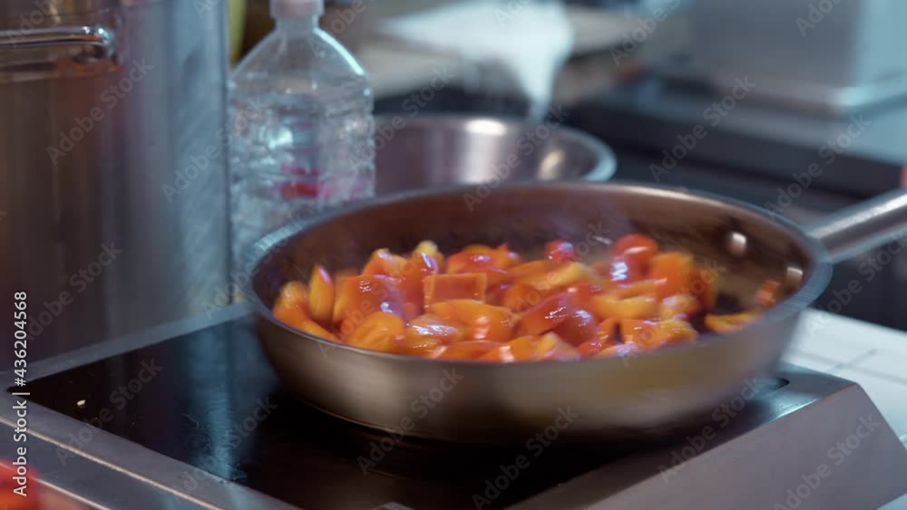 Bell pepper are fried onto a pan. Bell pepper are fried onto a pan.