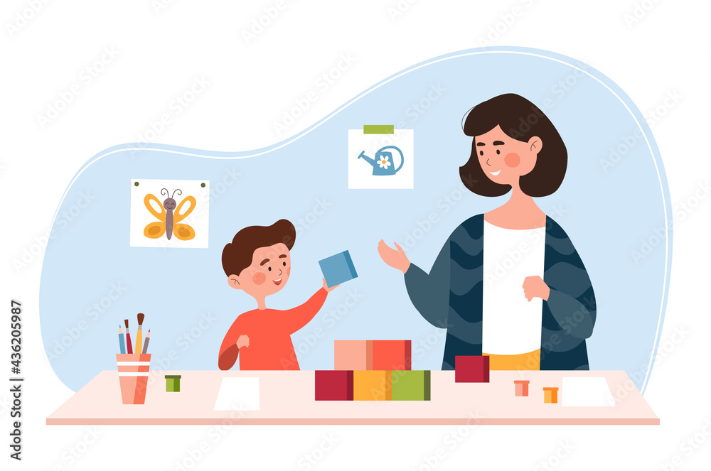 Young mother is playing with her little son at home with colorful blocks Young mother is playing with her little son at home with colorful blocks