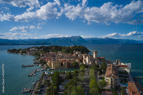 Sirmione  Lake Garda  Italy. Aerial view of the island of Sirmione. Castle on the water in Italy. Peninsula on a mountain lake in the background of the alps. Panorama of Lake Garda.