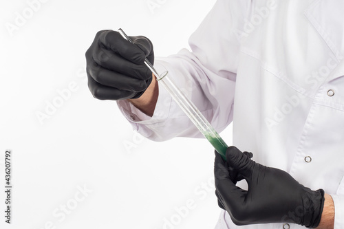 Green liquid in hands of a ...
