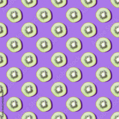 Kiwi slices pattern on a purple background.