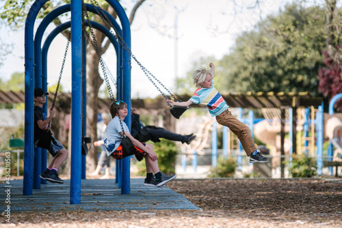 USA, California, San Francisco, Children on swings at playground photo