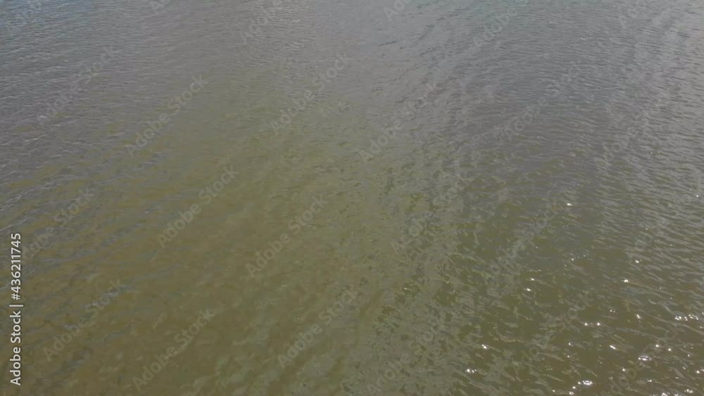 Flying over lake drone poit of view aerial camera movement