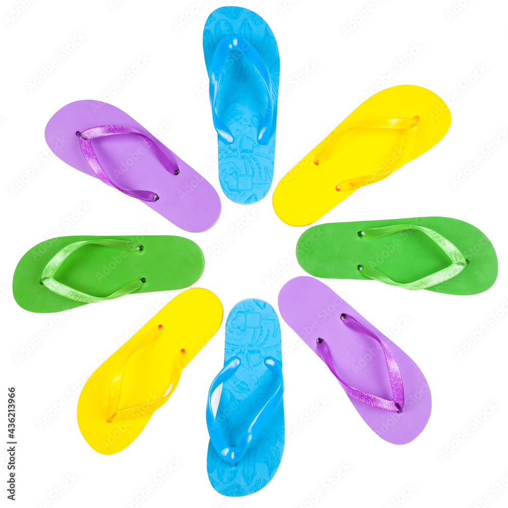 three pairs of rubber beach flip flops of different colors on a white background, view from above three pairs of rubber beach flip flops of different colors on a white background, view from above