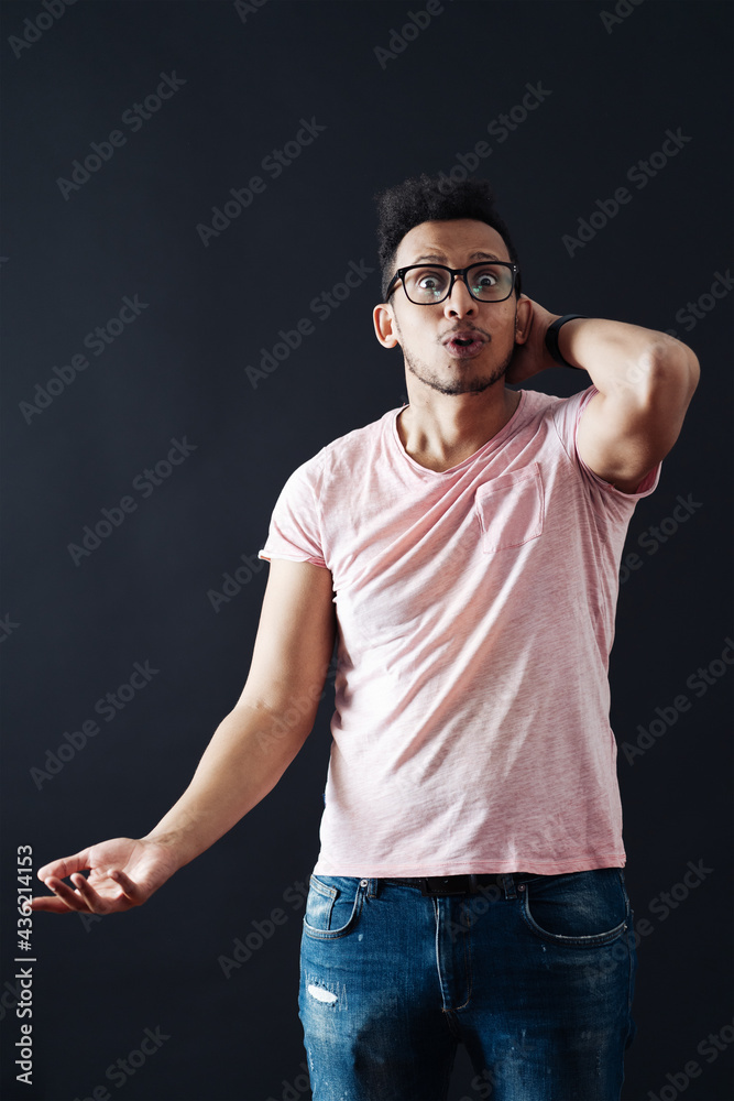 Emotional Attractive Male With Opened Mouth Expresses Great Surprisment And Frighteness Poses Against Black Background Stares At Camera Unexpected Shocking News And Human Reaction Stock Photo Adobe Stock