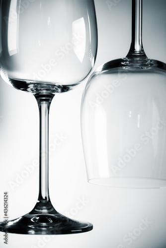 Empty wine glasses with a perfect reflection with dark tint